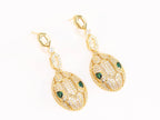 Gold Snake head pendant set with emerald detailing
