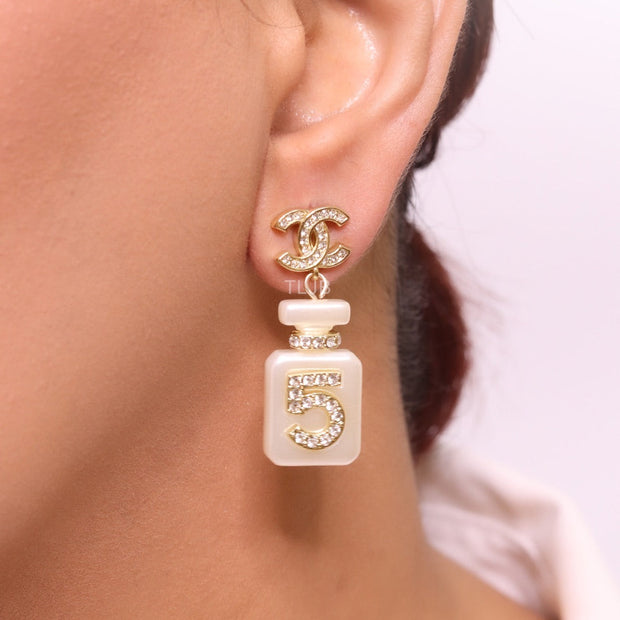 Double C gold danglers with 5 in CZ on white enamel