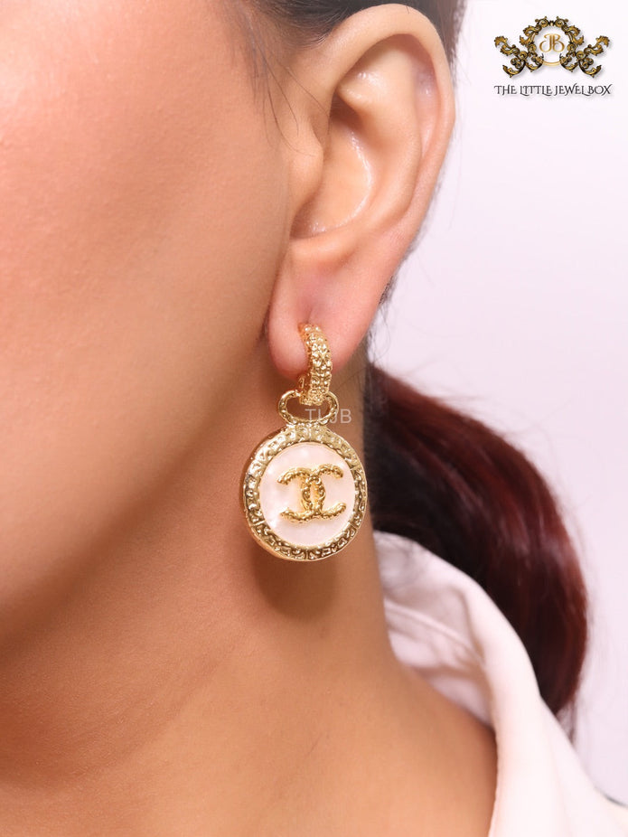 Double C on white enamel hanging gold earrings with CZ
