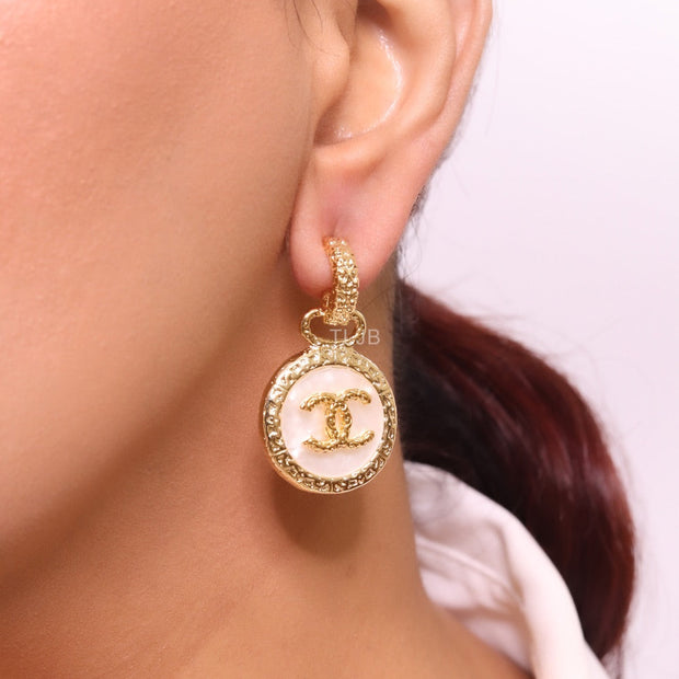 Double C on white enamel hanging gold earrings with CZ