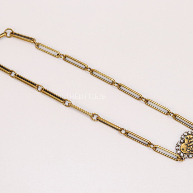 Gold plated link chain necklace with heart shaped alphabet pendant