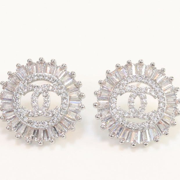 Round platinum studs lined with cz baguettes and twin C cz motif centre