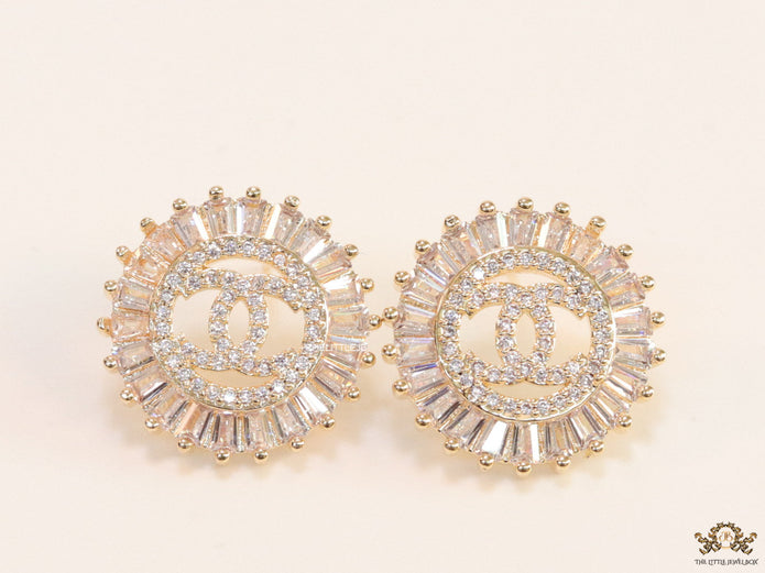 Round gold studs lined with cz baguettes and twin C cz motif centre