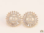 Round gold studs lined with cz baguettes and twin C cz motif centre