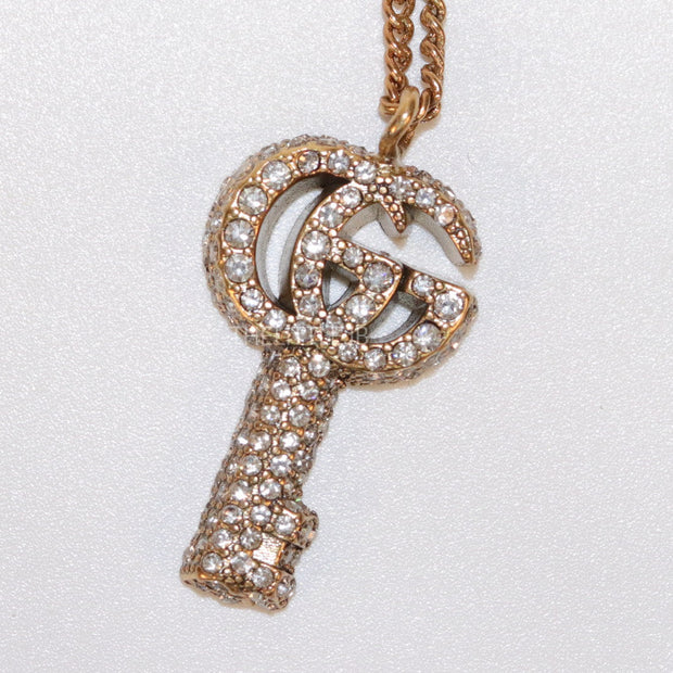 Gold plated chain necklace with cz G and key pendant