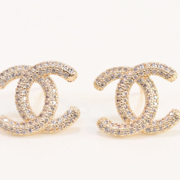 Gold plated twin C motif studs with cz
