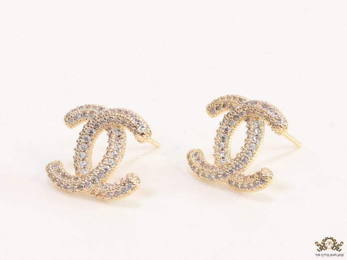 Gold plated twin C motif studs with cz