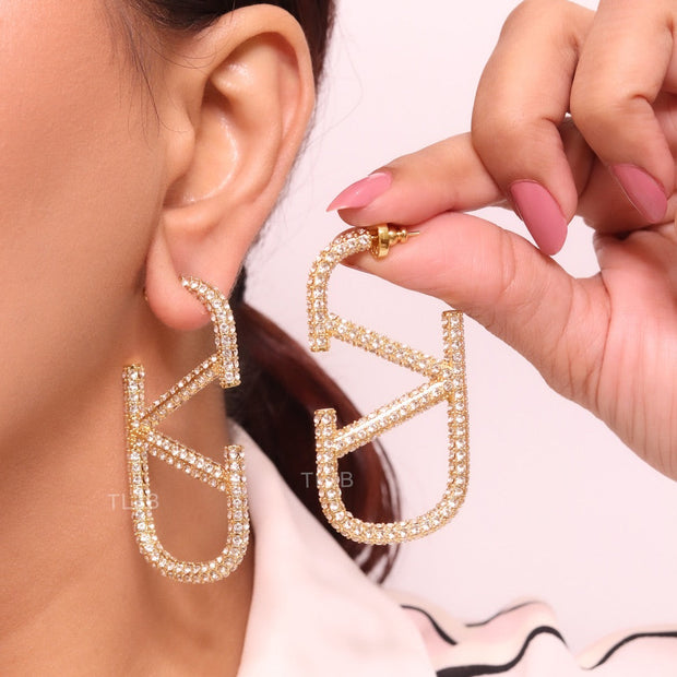 Open golden alphabet V earrings with cz 62 mm