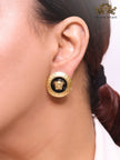 Gold round medusa motif black enamel earrings