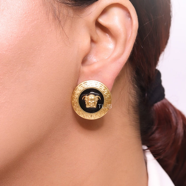 Gold round medusa motif black enamel earrings