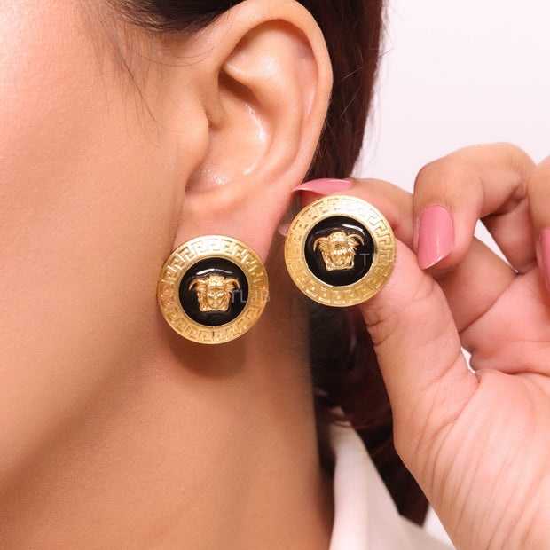 Gold round medusa motif black enamel earrings