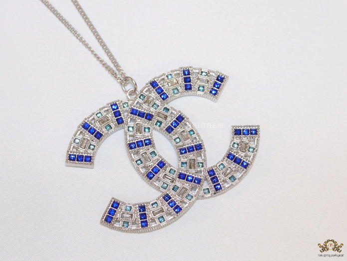 Platinum chain alphabet necklace with coloured cz