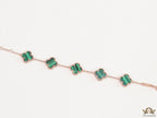 Rose gold plated chain bracelet with clovers in malachite green