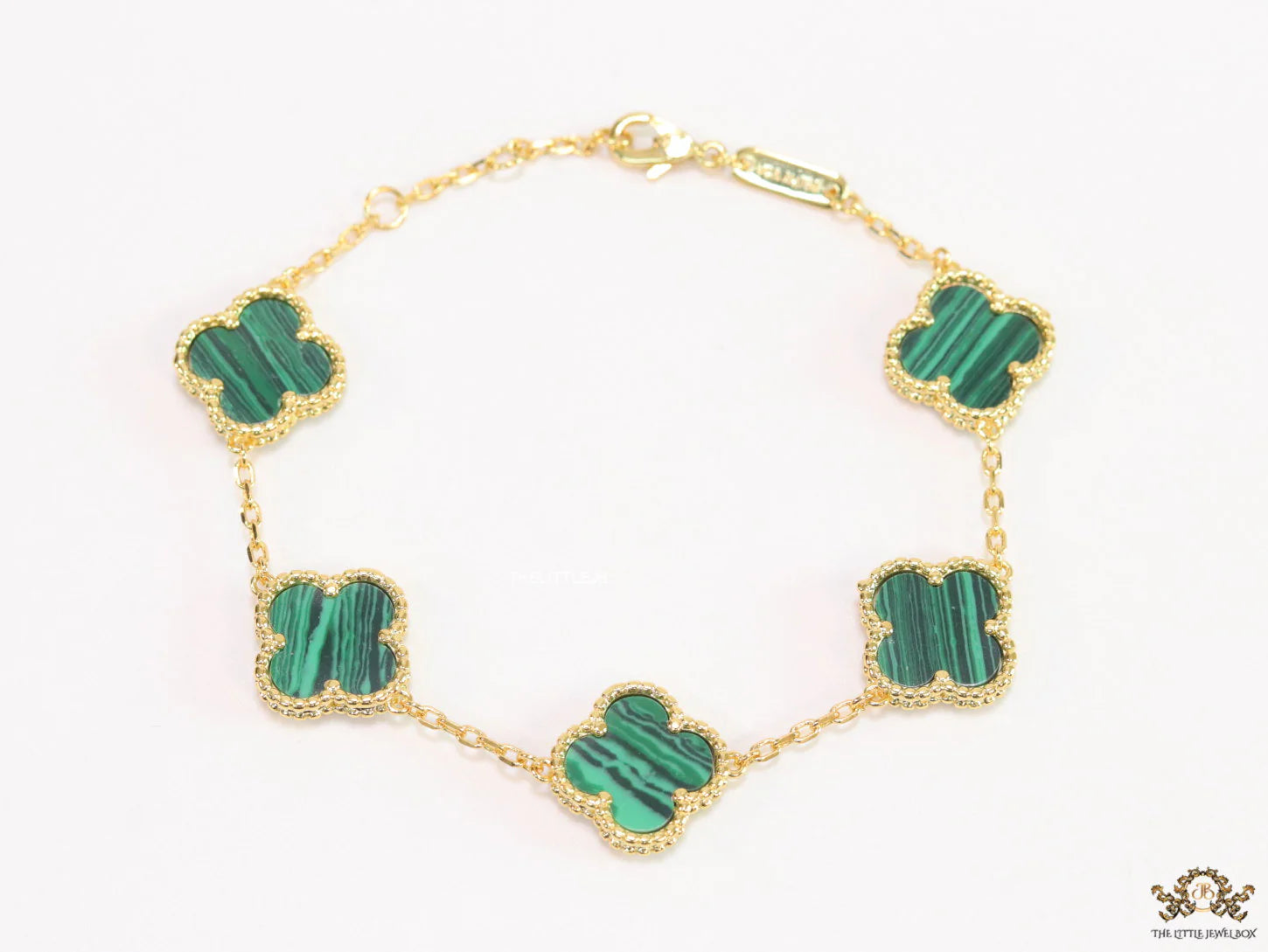Gold plated chain bracelet with clovers in malachite green