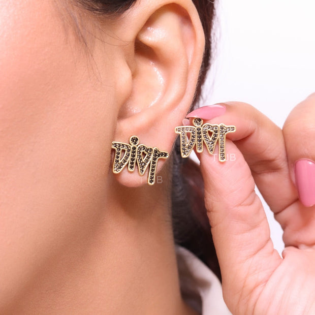 Gold Alphabet C and D earrings with black stones