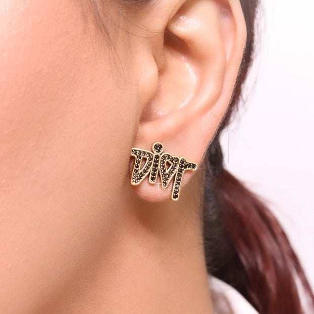 Gold Alphabet C and D earrings with black stones