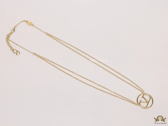 Dual chain golden necklace with alphabet pendant