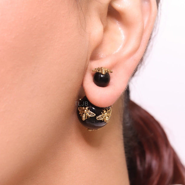 Rustic dragonfly on black pearls in gold