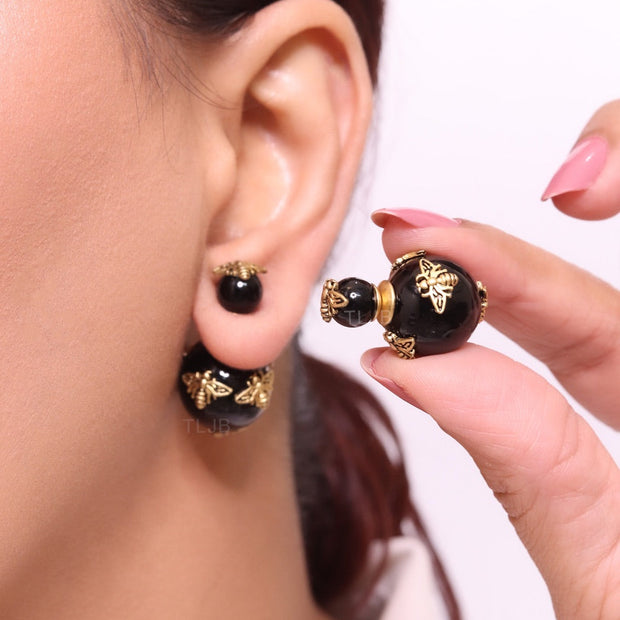 Rustic dragonfly on black pearls in gold
