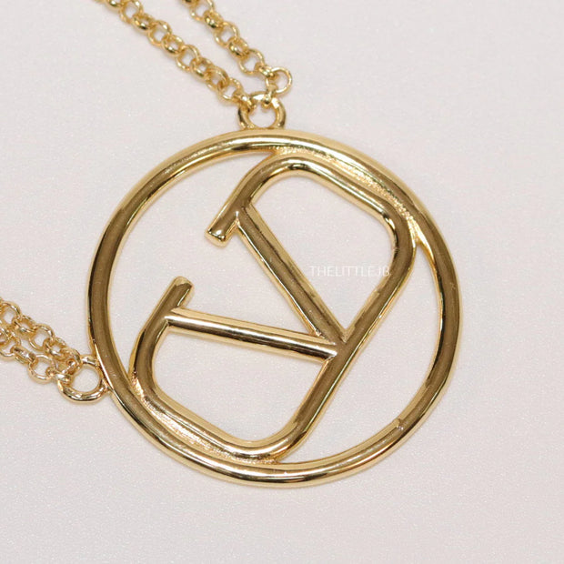 Dual chain golden necklace with alphabet pendant