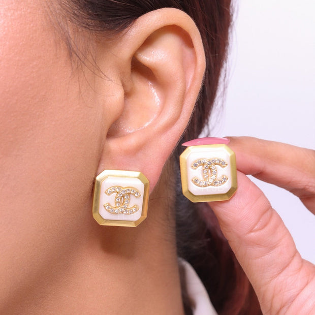 Square white enamel Double C gold earrings