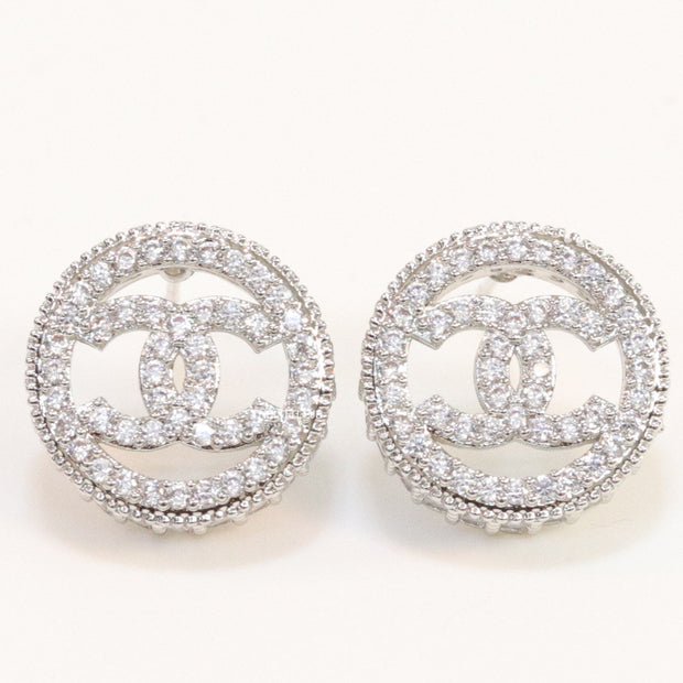 Round platinum studs lined with cz and twin C motif centre