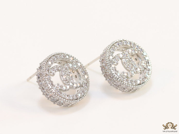 Round platinum studs lined with cz and twin C motif centre