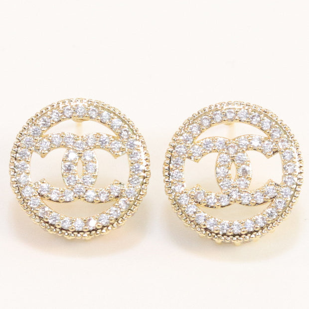 Round golden studs lined with cz and twin C motif centre