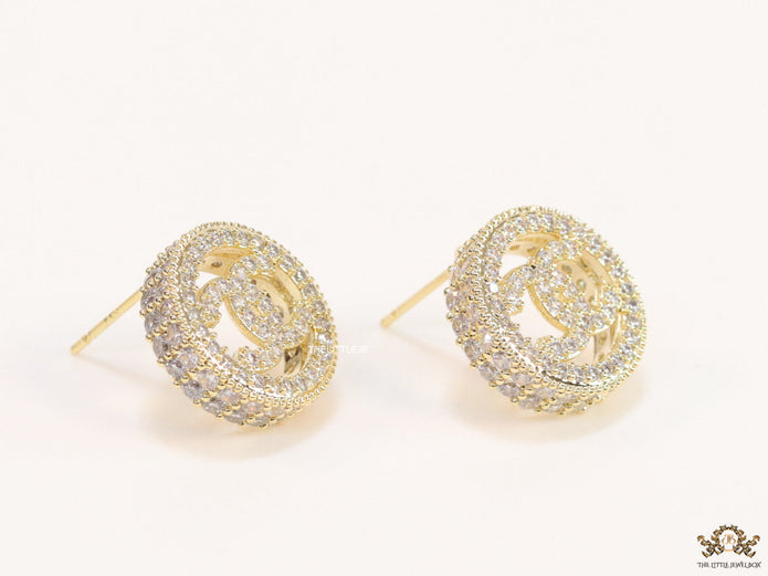 Round golden studs lined with cz and twin C motif centre