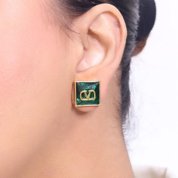 Alphabet V blue and gold studs