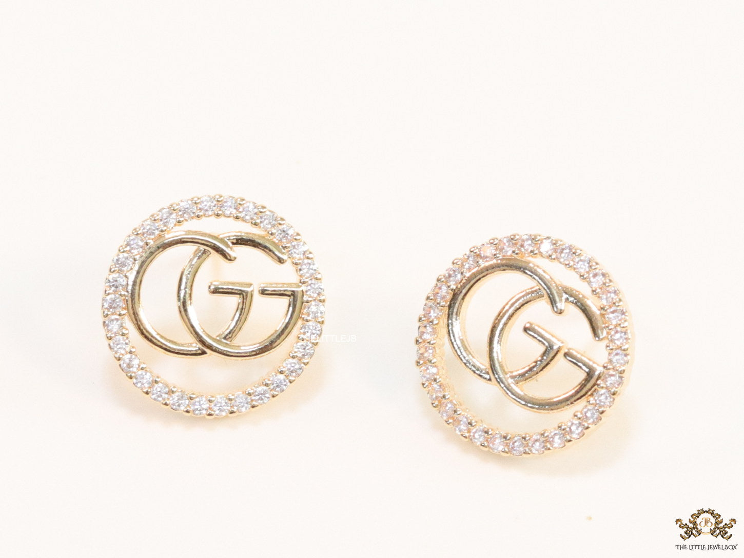 Gold plated round cz earrings with twin G motif