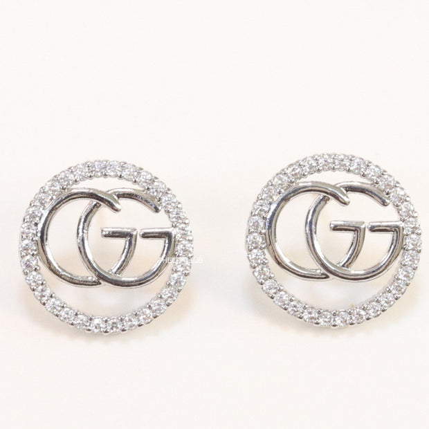 Platinum plated round cz earrings with twin G motif