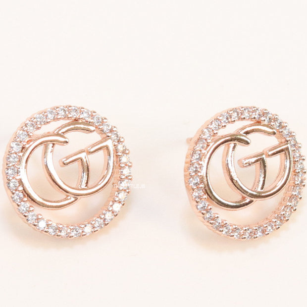 Rose gold plated round cz earrings with twin G motif
