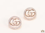 Rose gold plated round cz earrings with twin G motif