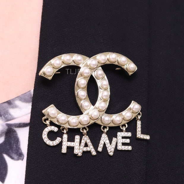 Platinum Double C pearl brooch with charms