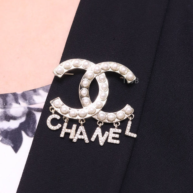 Platinum Double C pearl brooch with charms