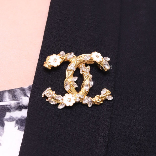 Gold Double C brooch with enamel flowers and cz leaves