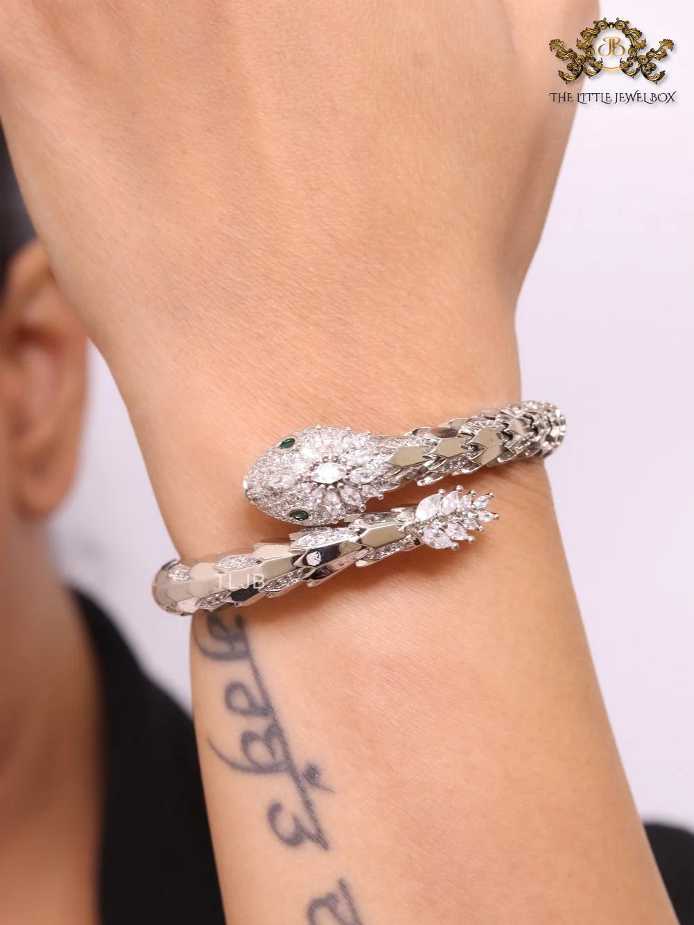 Platinum Snake head cz bracelet with emerald detailing