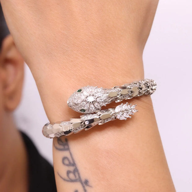 Platinum Snake head cz bracelet with emerald detailing
