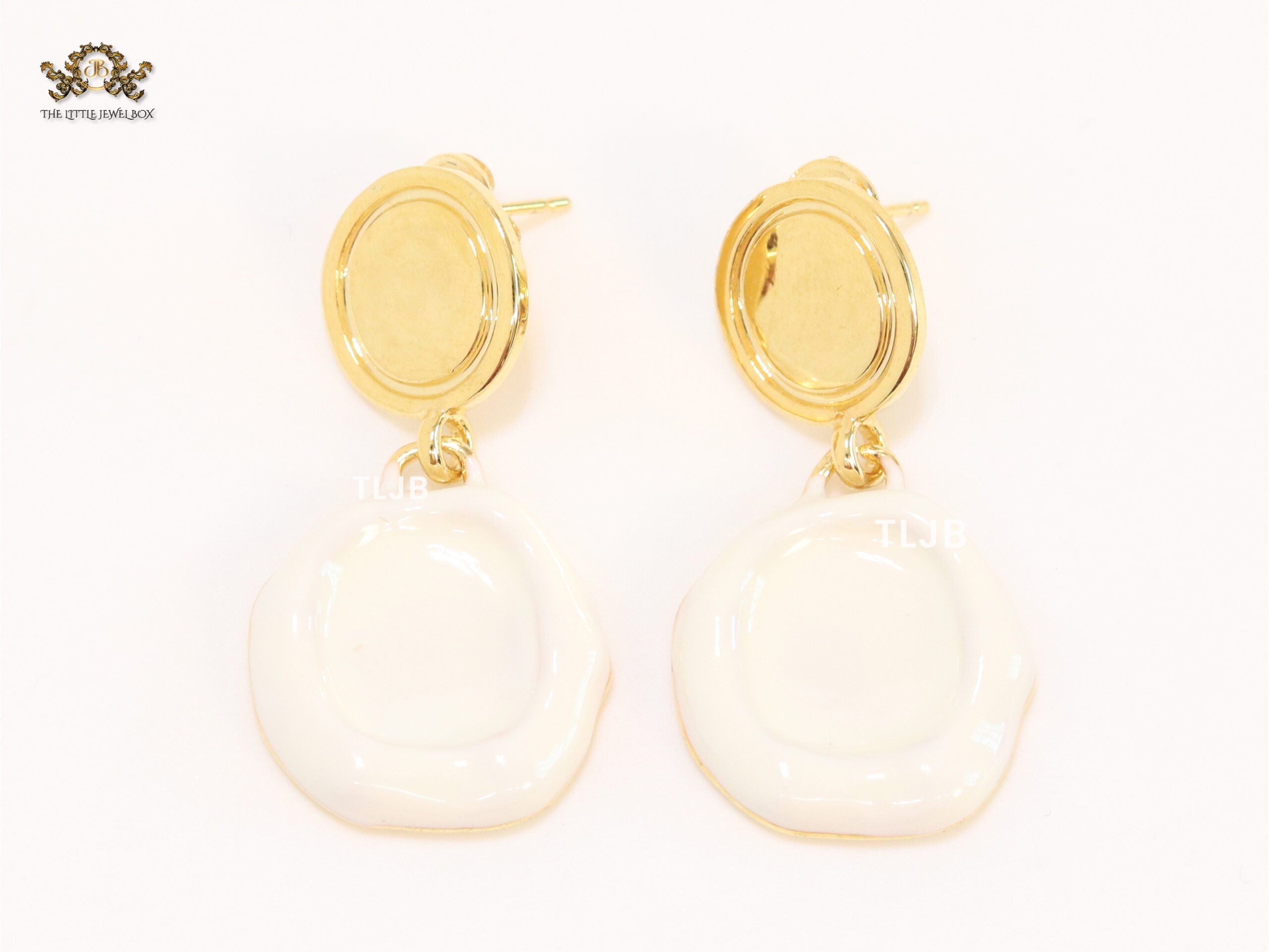 White enamel and gold earrings