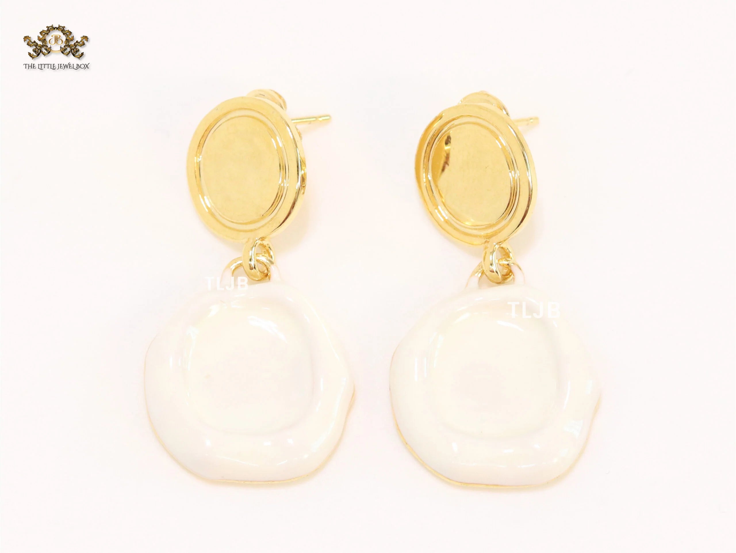 White enamel and gold earrings