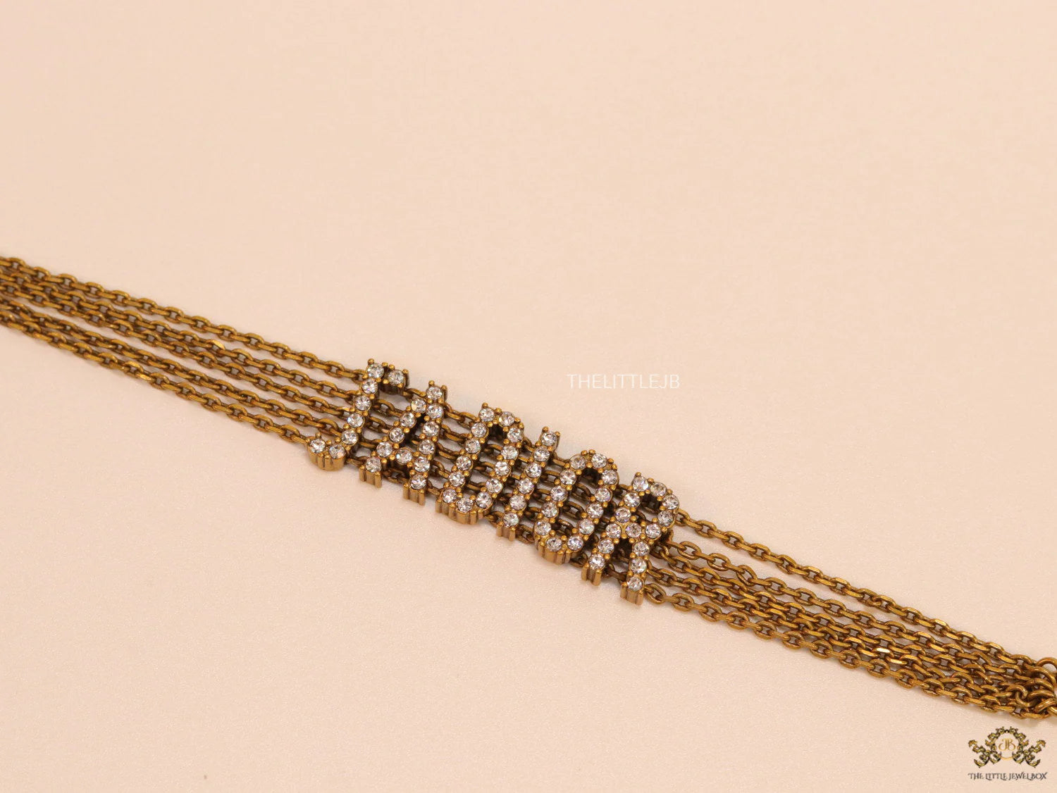 Multichain bracelet with cz alphabet CD in antique gold finish