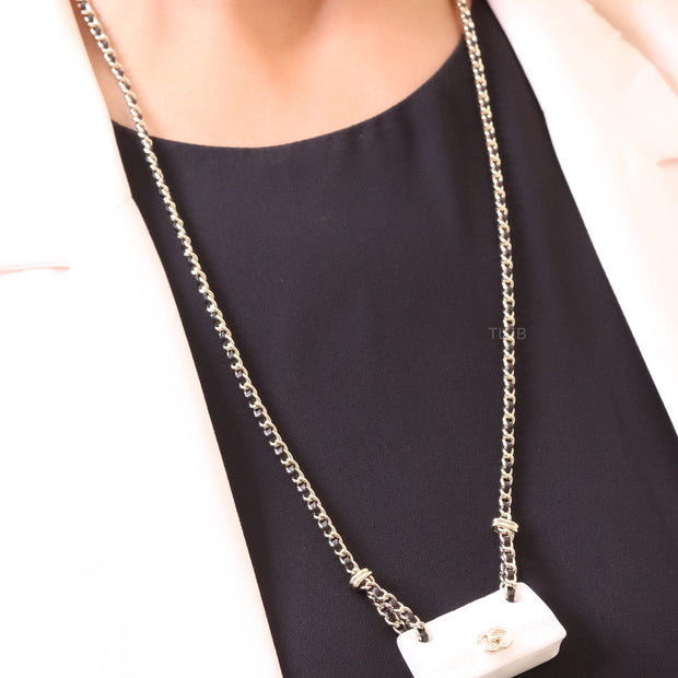 Double C enamel Bag on a black and gold chain