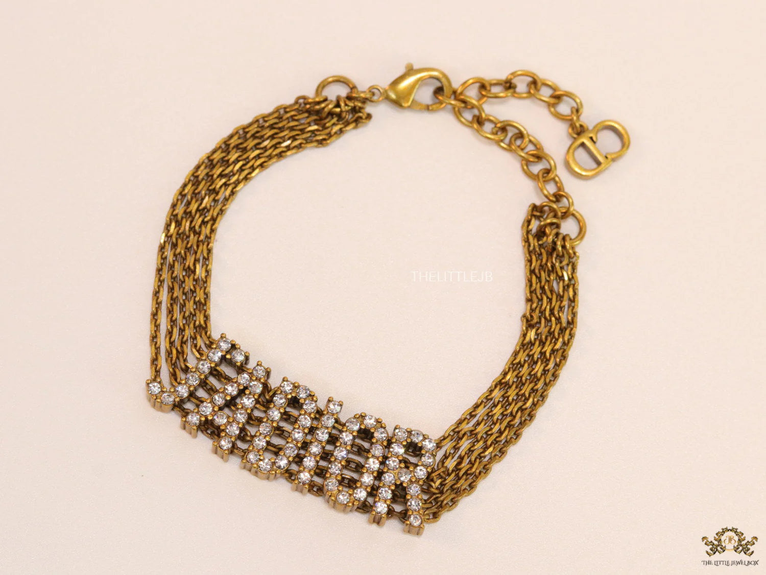Multichain bracelet with cz alphabet CD in antique gold finish