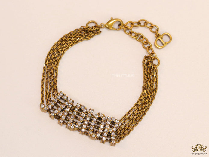 Multichain bracelet with cz alphabet CD in antique gold finish