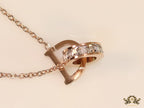 Rose gold plated D initial necklace with interlocking cz ring