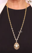 Gold Snake head pendant set with emerald detailing