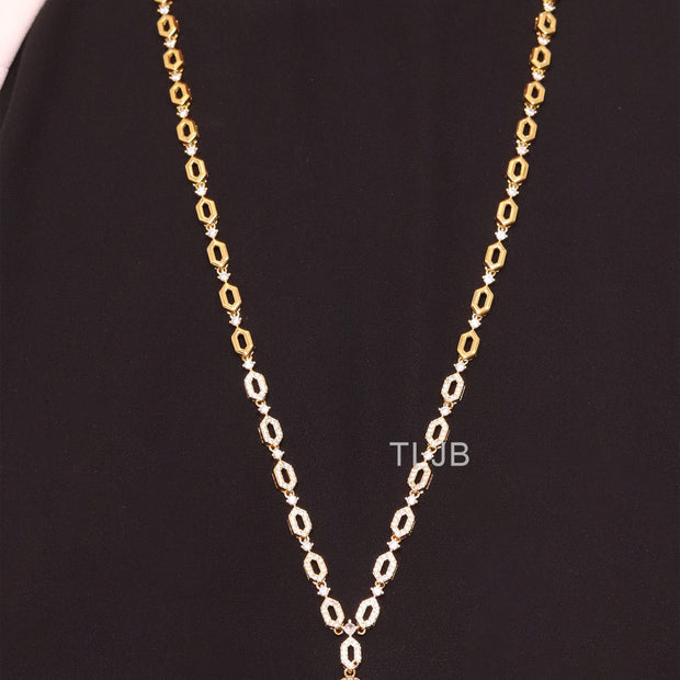 Gold Snake head pendant set with emerald detailing