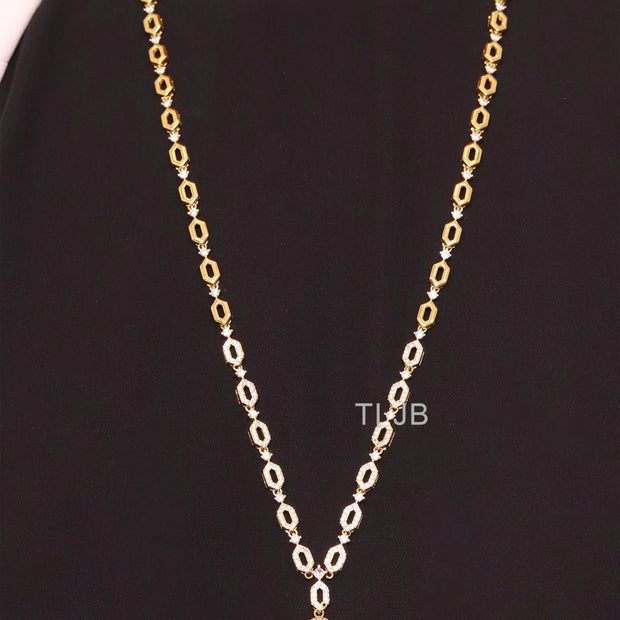 Gold Snake head pendant set with emerald detailing