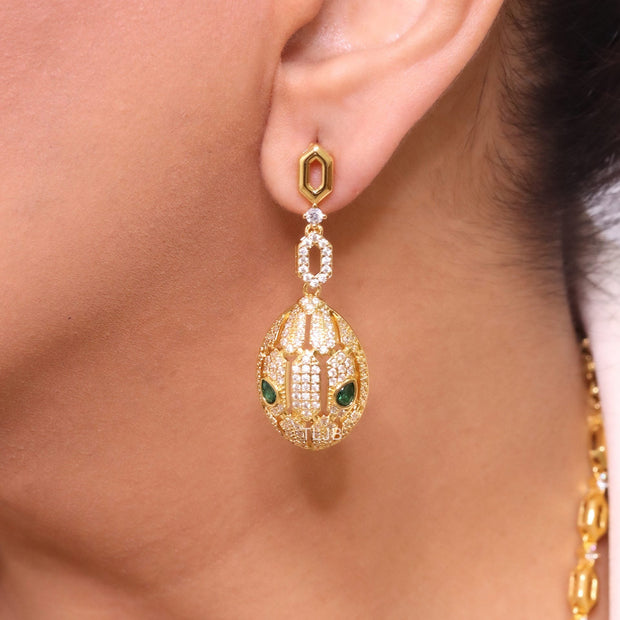 Gold Snake head pendant set with emerald detailing